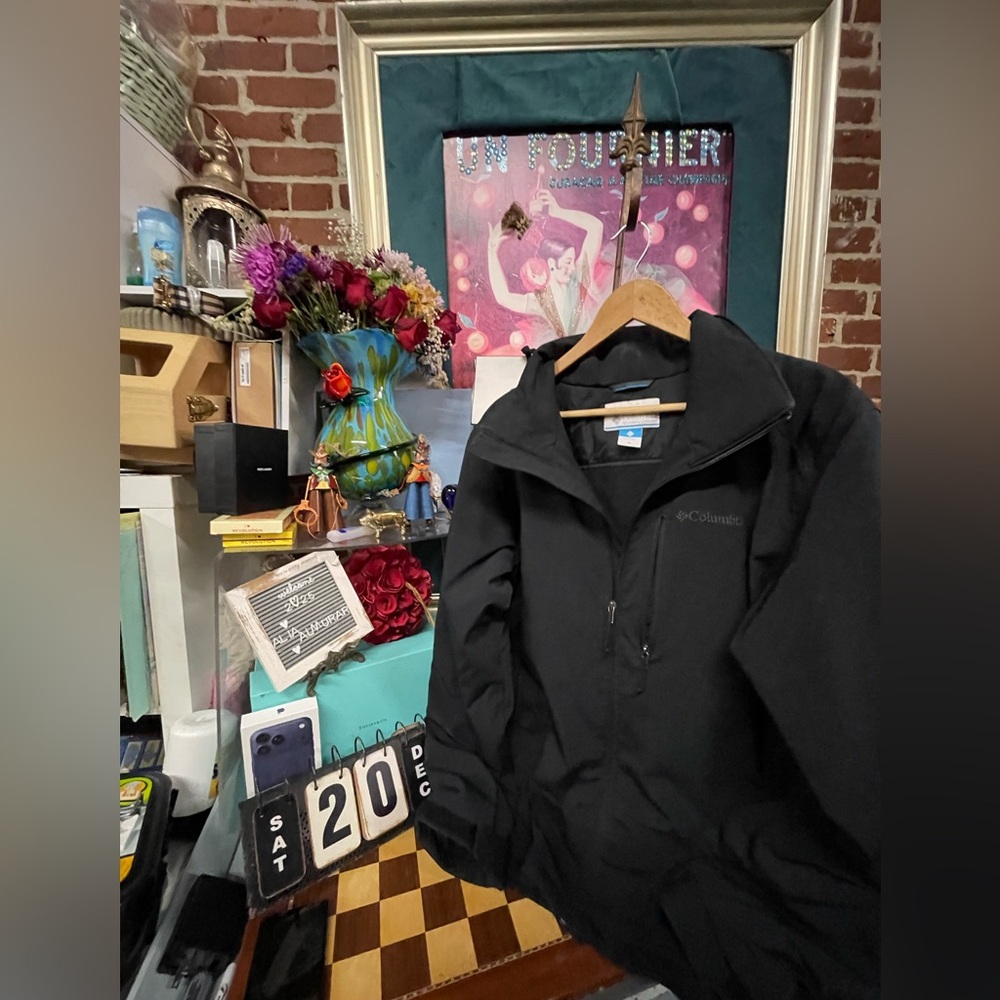 Columbia a black and green Kawasaki motorcycle jacket.